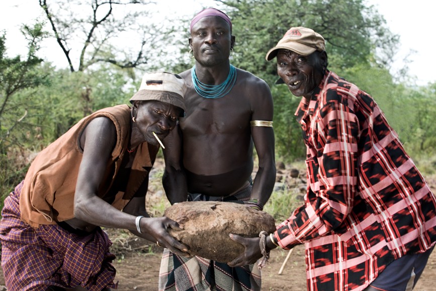 Mursi elders lift the first stone